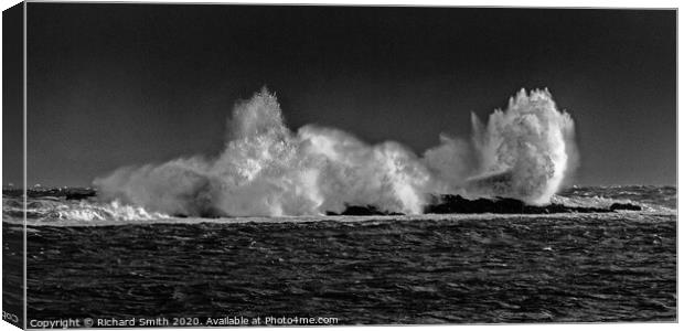 Breaking wave on rocks. Canvas Print by Richard Smith