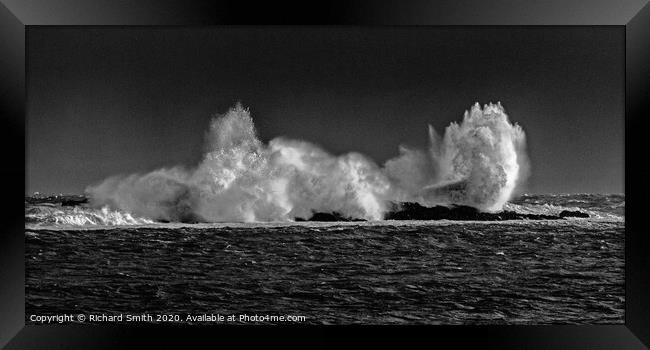 Breaking wave on rocks. Framed Print by Richard Smith