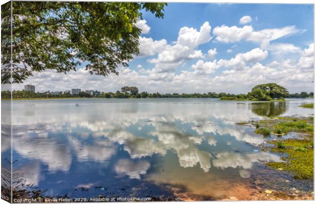 Cloud reflections in Inya Lake, Yangon, Myanmar Canvas Print by Kevin Hellon