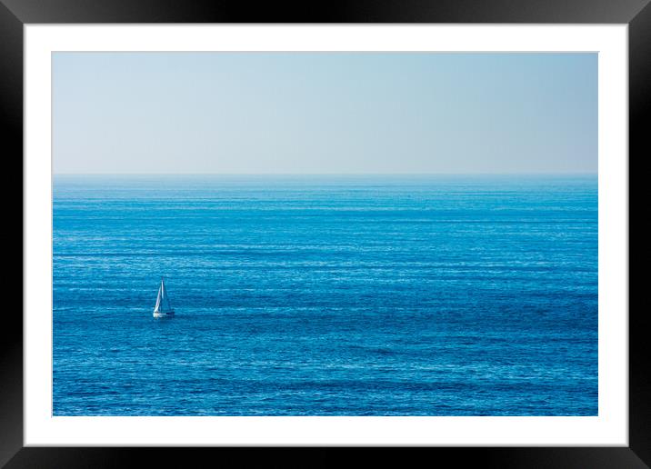 sailboat sailing in the middle of the ocean Framed Mounted Print by David Galindo
