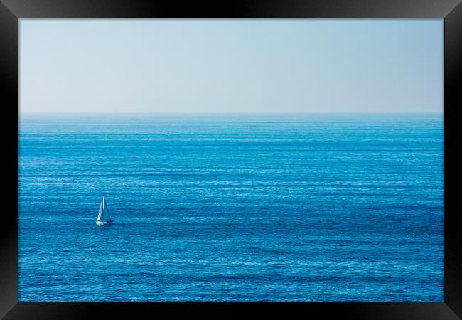 sailboat sailing in the middle of the ocean Framed Print by David Galindo