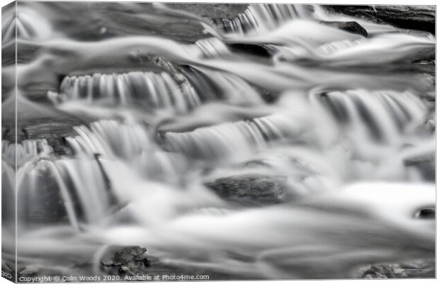 Detail of waterfalls in a stream taken as a long t Canvas Print by Colin Woods