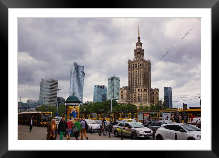 Warsaw, Poland - June 01, 2017: Cityscape showing people and traffic against Palace of Culture and sciences one of the main travel attractions, symbol of Warsaw city located in central Europe Framed Mounted Print by Arpan Bhatia