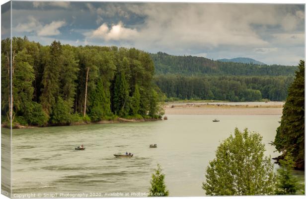 Fishermen fishing for salmon on the Skeena River below Terrace, during a cloudy day in summer, in British Columbia, Canada Canvas Print by SnapT Photography