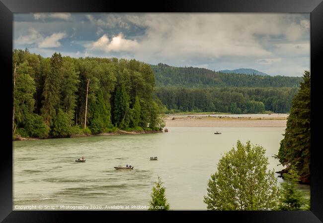 Fishermen fishing for salmon on the Skeena River below Terrace, during a cloudy day in summer, in British Columbia, Canada Framed Print by SnapT Photography