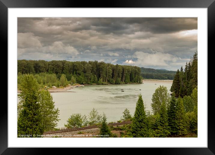 Fishermen fishing for salmon on the Skeena River below Terrace, during a cloudy day in summer, beside the CN Railway Line. Framed Mounted Print by SnapT Photography
