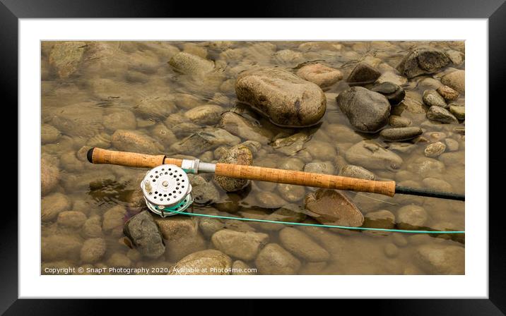 Spey fly rod and reel resting on wet rocks beside a river. Framed Mounted Print by SnapT Photography