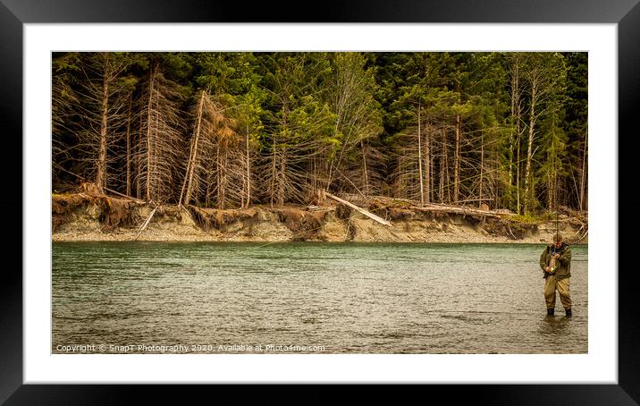 A man hooked into a fish while fly fishing in British Columbia, near Kitimat Framed Mounted Print by SnapT Photography
