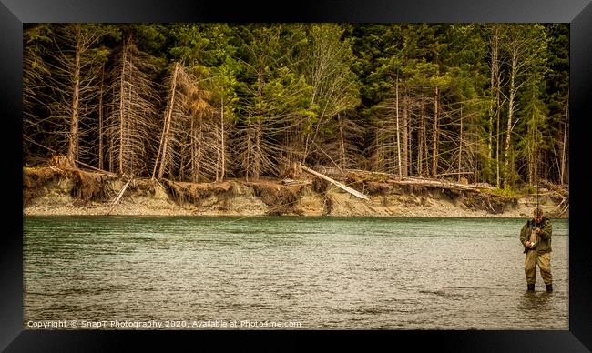 A man hooked into a fish while fly fishing in British Columbia, near Kitimat Framed Print by SnapT Photography