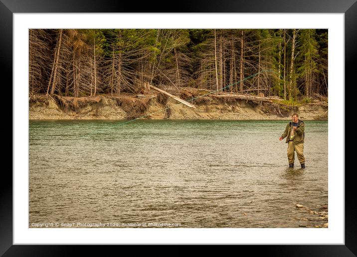A man hooked into a fish while fly fishing in British Columbia, near Kitimat Framed Mounted Print by SnapT Photography