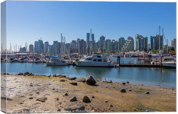 The Vancouver skyline across Coal Harbour from the sea wall on Stanley Park Canvas Print by SnapT Photography