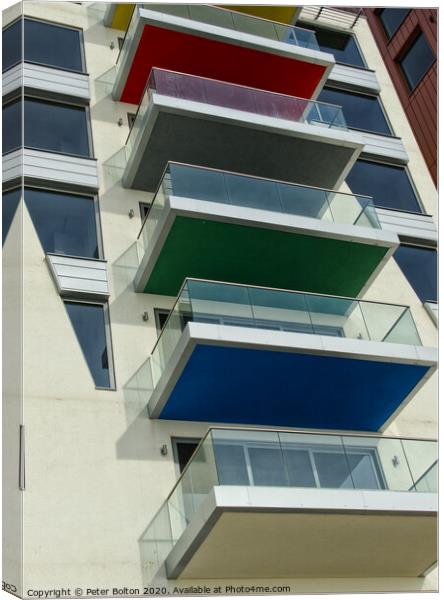 An abstract pattern formed by balconies in an apartment block at Westcliff on Sea, Essex, UK. Canvas Print by Peter Bolton