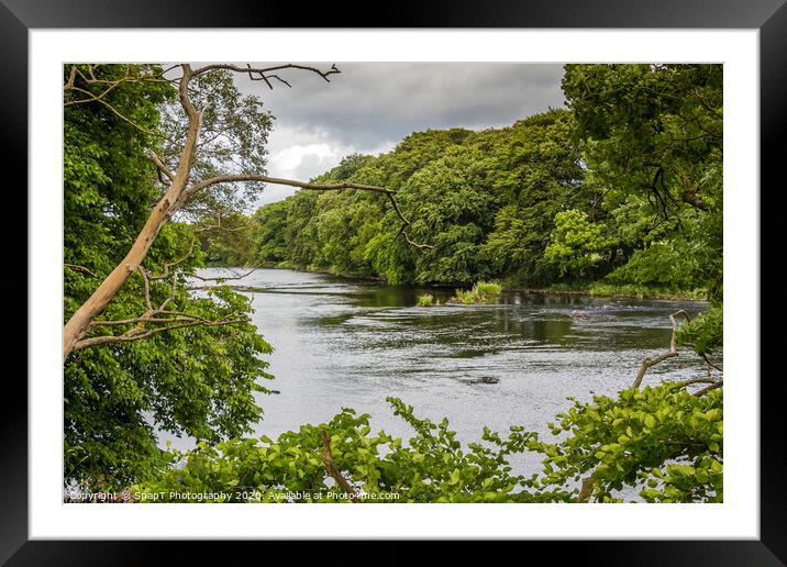 A view of a river through a gap in trees in summer Framed Mounted Print by SnapT Photography