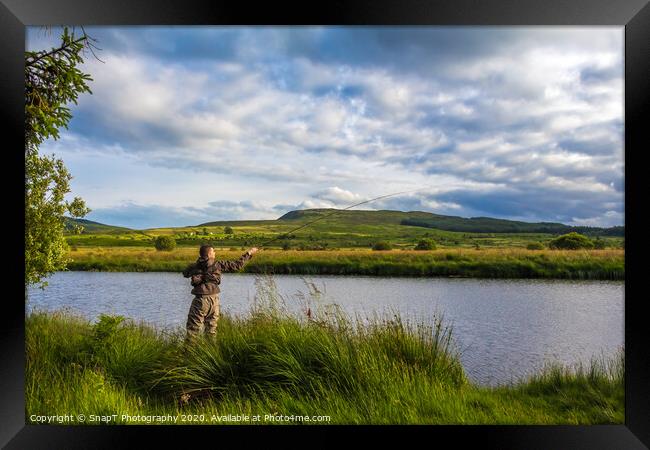 A fisherman fly fishing in the evening on the Blac Framed Print by SnapT Photography