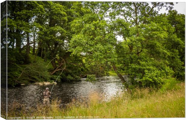 A fisherman spey casting for salmon using a fly ro Canvas Print by SnapT Photography