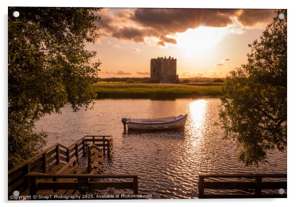 The evening sun behind Threave Castle at the boat  Acrylic by SnapT Photography