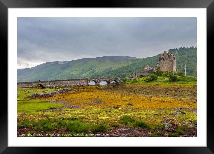 Looking out to Eilean Donan Castle on an overcast day in the Scottish highlands. Framed Mounted Print by SnapT Photography