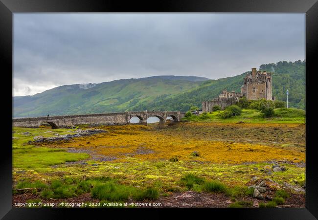Looking out to Eilean Donan Castle on an overcast day in the Scottish highlands. Framed Print by SnapT Photography