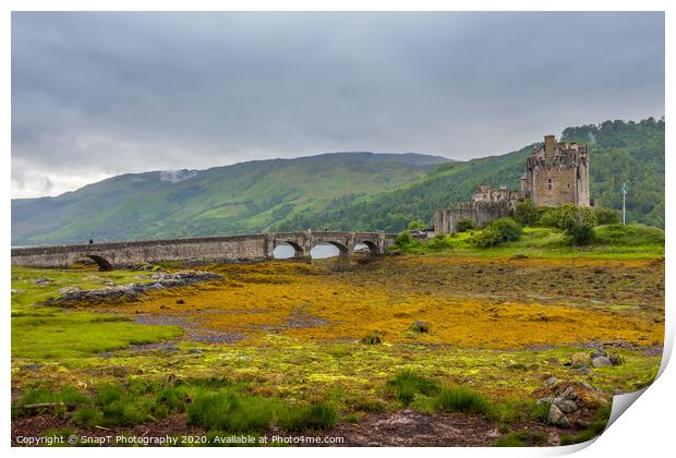 Looking out to Eilean Donan Castle on an overcast day in the Scottish highlands. Print by SnapT Photography