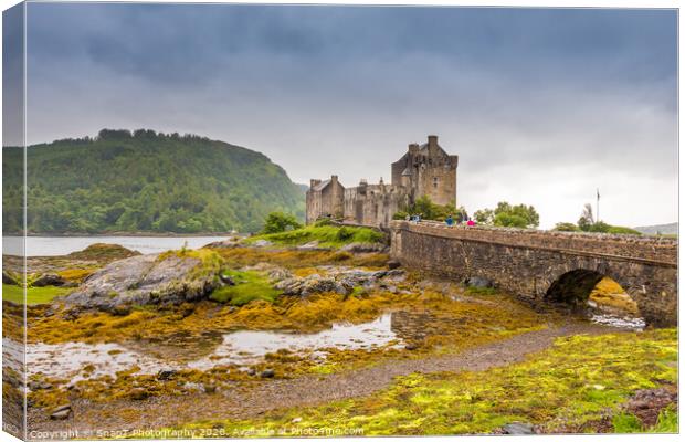 Stormy evening clouds over Eilean Donan Castle in the Scottish Highlands Canvas Print by SnapT Photography