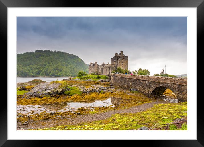 Stormy evening clouds over Eilean Donan Castle in the Scottish Highlands Framed Mounted Print by SnapT Photography