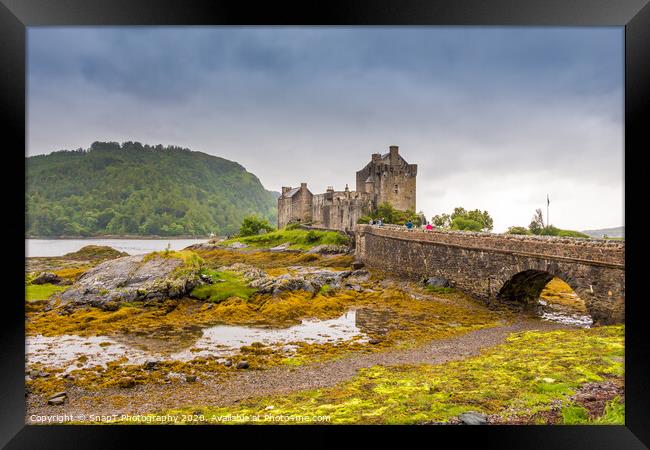 Stormy evening clouds over Eilean Donan Castle in the Scottish Highlands Framed Print by SnapT Photography