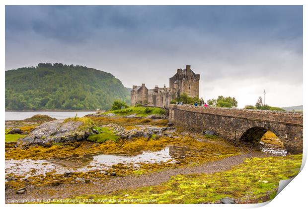 Stormy evening clouds over Eilean Donan Castle in the Scottish Highlands Print by SnapT Photography