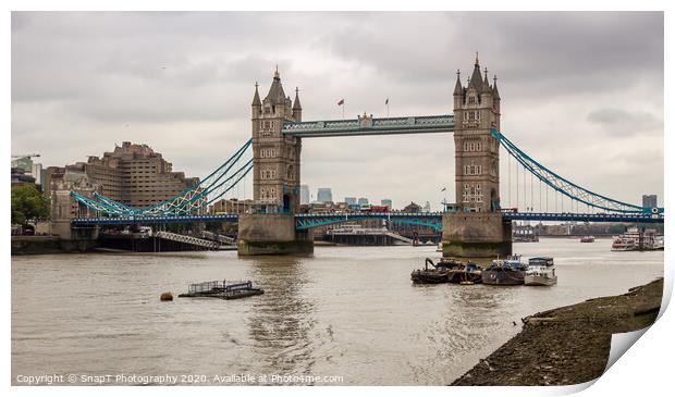 The historic Tower Bridge on the River Thames on a cloudy day in London Print by SnapT Photography