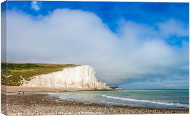 Dramatic white cliffs, blue sky and shingle beach  Canvas Print by SnapT Photography