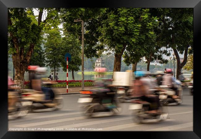 Motorbike motion at Hoan Kiem lake and turtle tower in the background Framed Print by SnapT Photography
