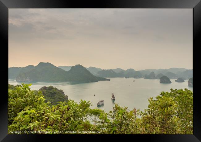 Beautiful early morning view over the islands of Ha Long Bay, Vietnam Framed Print by SnapT Photography