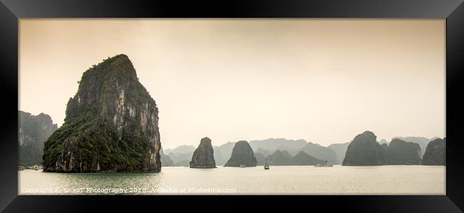 Limestone karst islands in Ha long Bay, Vietnam Framed Print by SnapT Photography