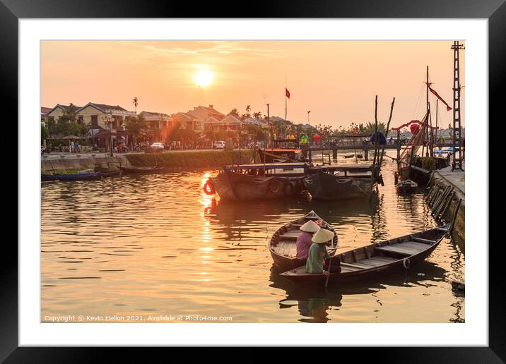 Women in a boat on the river at sunset Framed Mounted Print by Kevin Hellon
