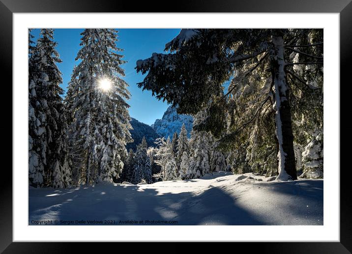 sun's rays in winter Framed Mounted Print by Sergio Delle Vedove
