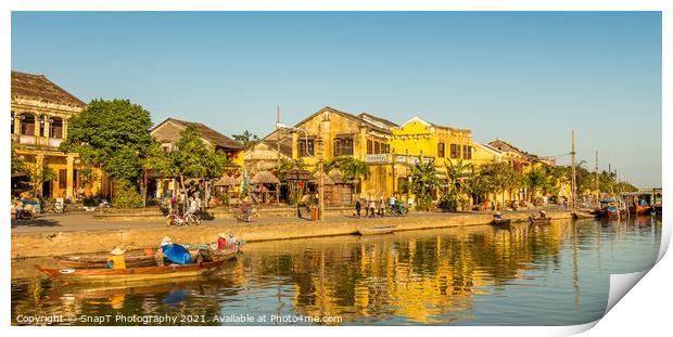 The ancient town of Hoi An in Vietnam, reflecting on the water Print by SnapT Photography