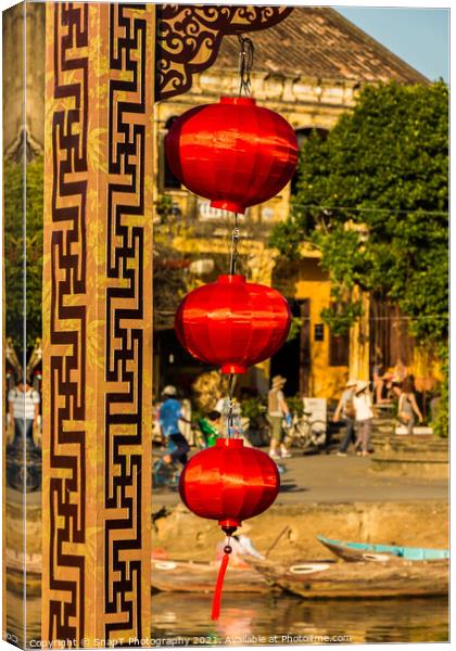 Three red vietnamese or chinese lanterns hanging in Hoi An, Vietnam Canvas Print by SnapT Photography