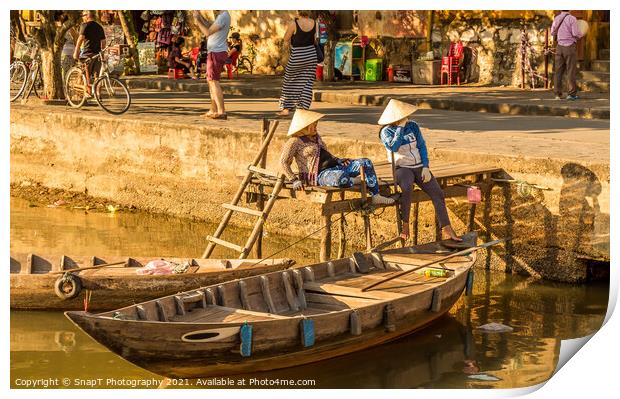 Two vietnamese ladies with conical hats relaxing by the river Print by SnapT Photography