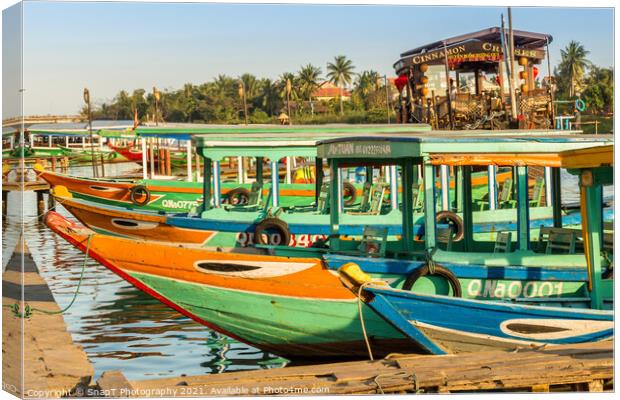 Colorful Vietnamese traditional boats, moored on the harbour wall, Hoi An, Vietnam - January 10th, 2015 Canvas Print by SnapT Photography