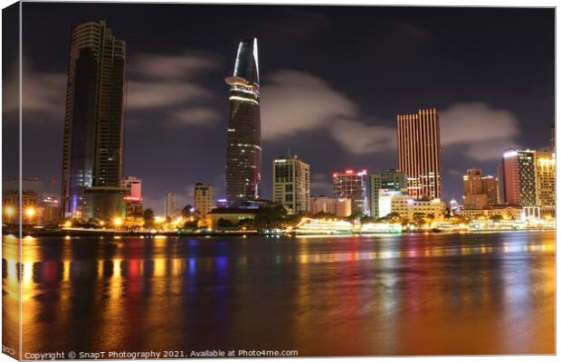 Long exposure and reflection of the Ho Chi Minh City skyline at night Canvas Print by SnapT Photography