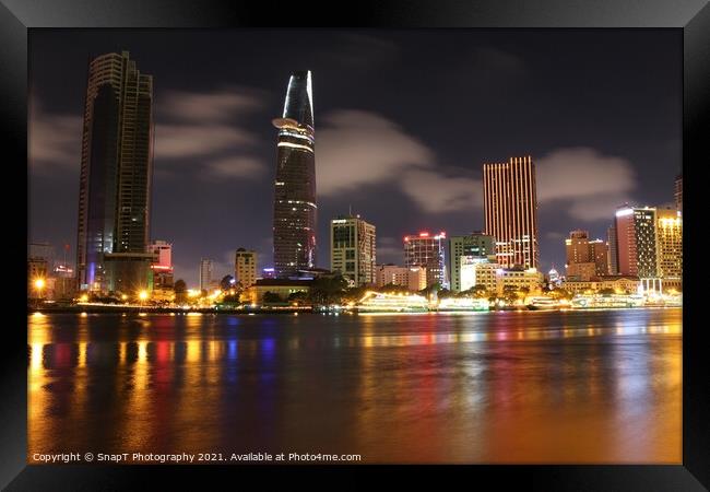 Long exposure and reflection of the Ho Chi Minh City skyline at night Framed Print by SnapT Photography