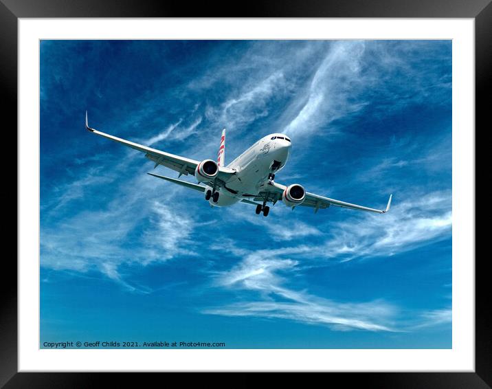 Commercial Aircraft flying among cloud. Framed Mounted Print by Geoff Childs