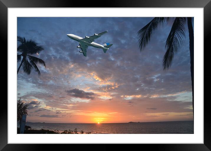 Aircraft flying in tropical dawn sky. Thailand. Framed Mounted Print by Geoff Childs
