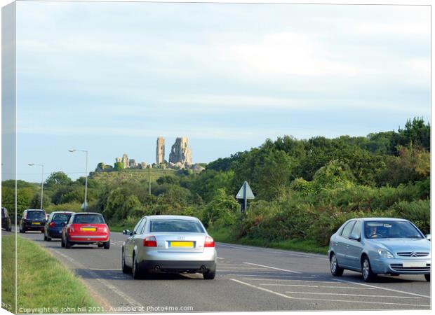 Corfe Castle as seen from the road. Canvas Print by john hill