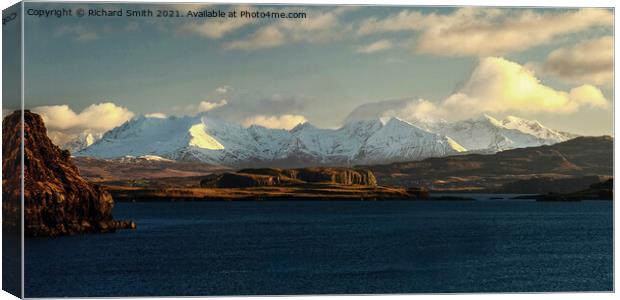Snow covered Cuillin beyond loch Bracadale. Canvas Print by Richard Smith