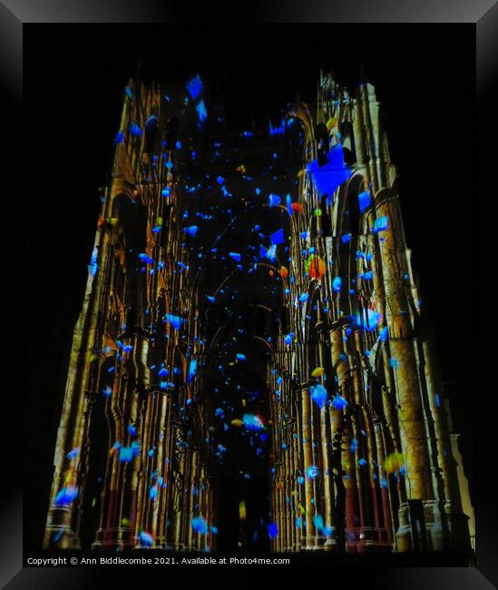 Disguised in colorful lights is Amiens Cathedral Framed Print by Ann Biddlecombe
