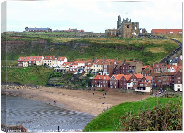 Old Whitby town beach and church in North Yorkshire. Canvas Print by john hill