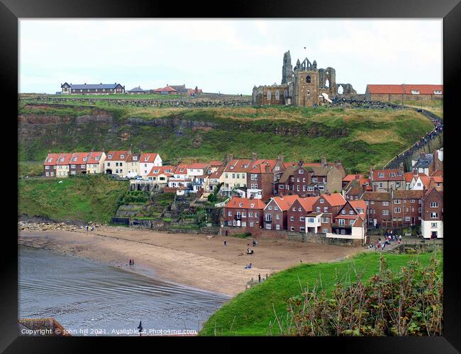 Old Whitby town beach and church in North Yorkshire. Framed Print by john hill