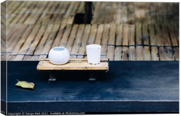Japanese ceramic bowl at old shrine Canvas Print by Sanga Park