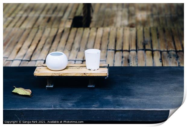 Japanese ceramic bowl at old shrine Print by Sanga Park