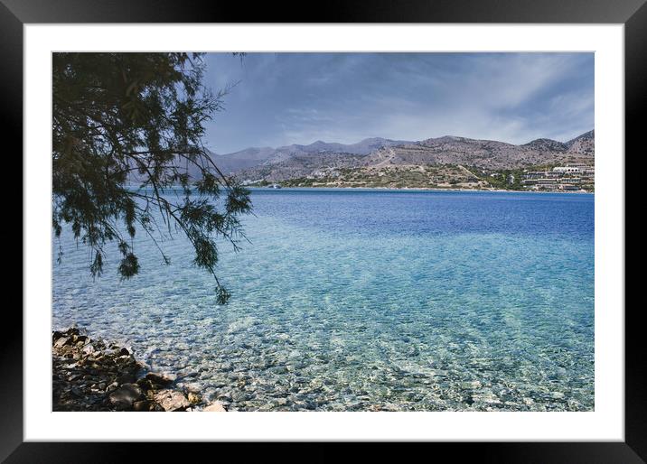 Crete or Kreta, Greece: View of the Mediterranean Sea against rocky terrain on Spinalonga island, formerly used as a leper colony, near Elounda, Mirabello Gulf Framed Mounted Print by Arpan Bhatia